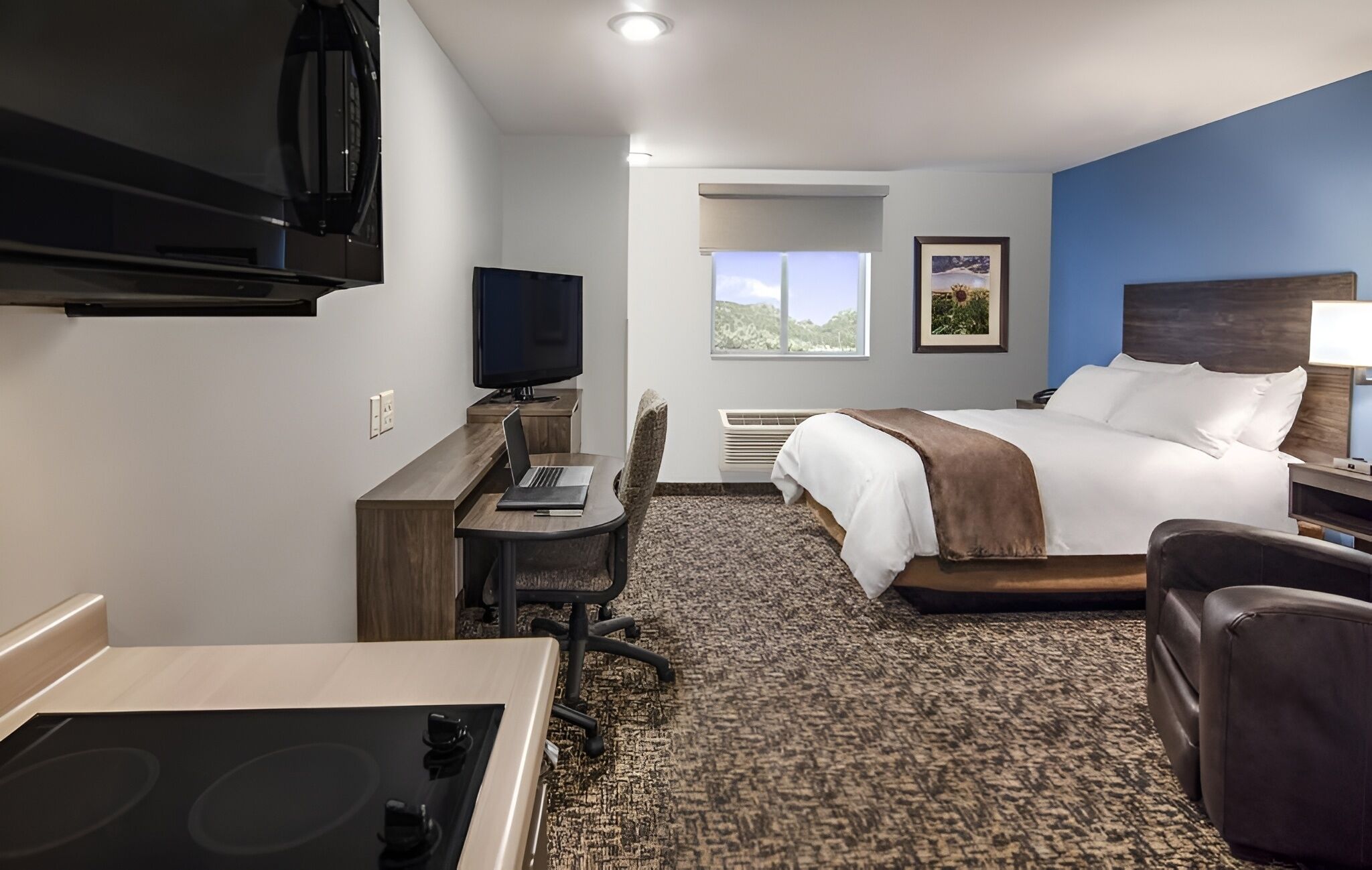 Settle into a spacious studio with bed, desk, and kitchenette.