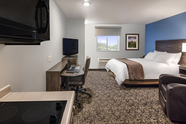 Settle into a spacious studio with bed, desk, and kitchenette.
