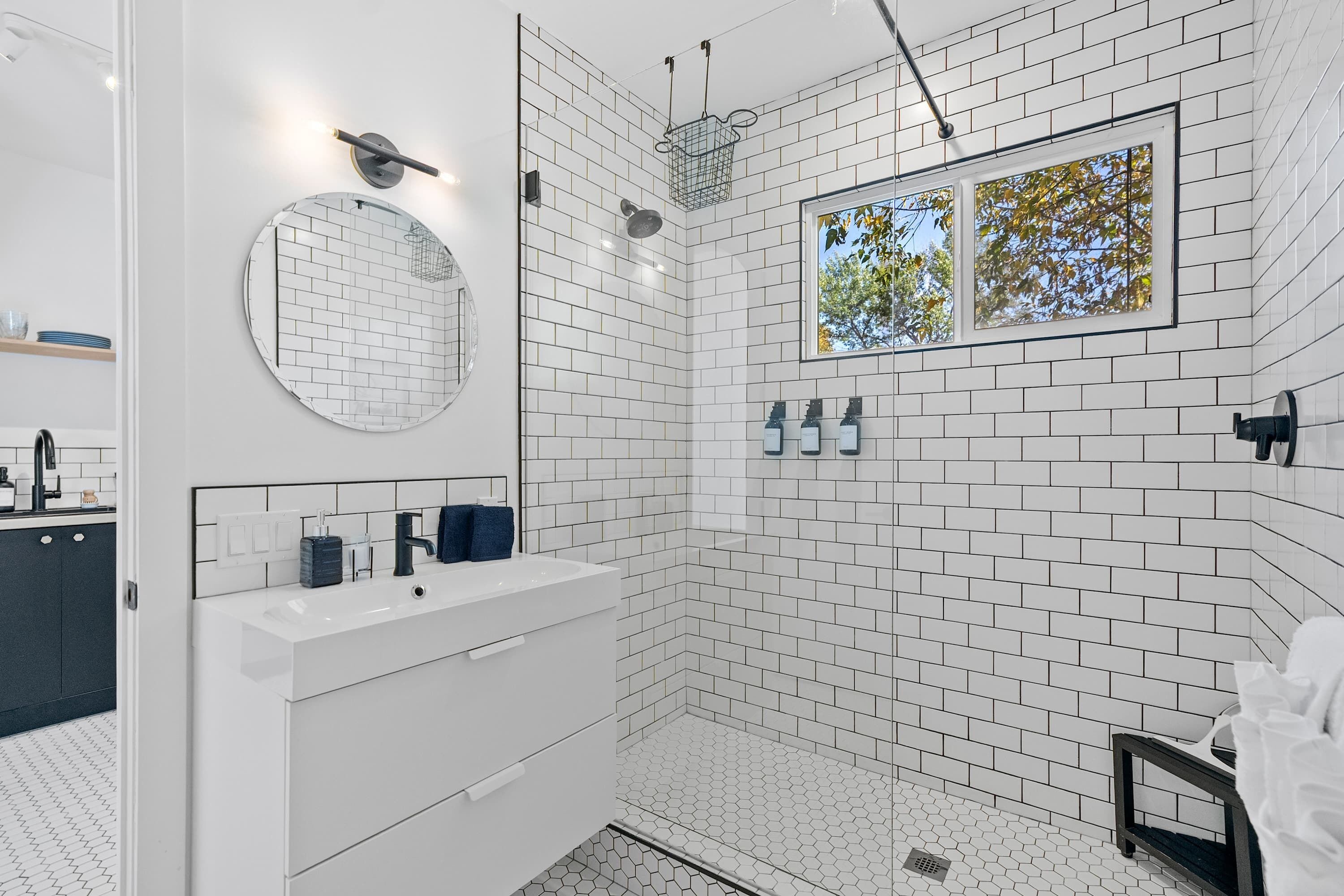 Shower, hair dryer, towels, shampoo