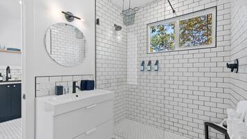 Shower, hair dryer, towels, shampoo