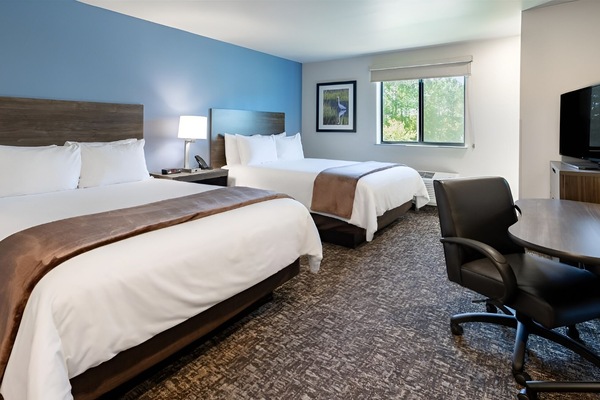Unwind in a bright double-queen room with serene views.