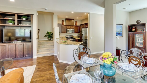 A modern kitchen with a central island, stainless steel appliances, and wooden cabinetry. - Oceanside Extended Stay Near Camp Pendleton (Oceanside)