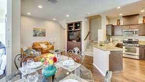 A modern kitchen with a central island, stainless steel appliances, and wooden cabinets. - Oceanside Extended Stay Near Camp Pendleton (Oceanside)