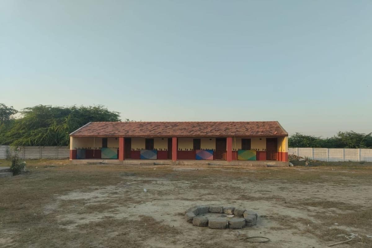 A single-story building with a tiled roof and a flat facade.