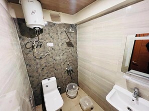 Basic Double Room, City View | Bathroom | Shower, towels, soap, toilet paper - Hotel Maa Bhuvneswari (Badrinath)