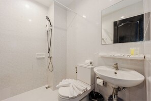 A modern bathroom with a shower, toilet, and sink. - 1BR Condo Pool Gym Near Beach C237 (Choeng Thale)