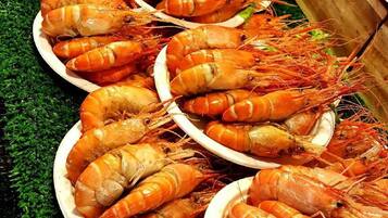 A display of cooked shrimp arranged on plates.