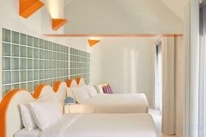 A hotel room with two beds, a tiled wall, and a window with curtains. - Molly Beach House by Yudee Assets (Hua Hin)