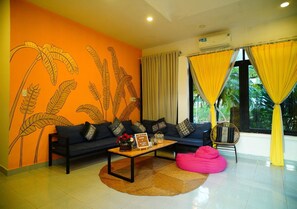 Luxury Apartment, Patio, Garden View | Living area | Flat-screen TV