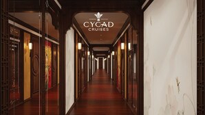 A long, narrow hallway with wooden floors and walls, featuring traditional Chinese architectural elements. - Cycad Cruise (Bai Chay)