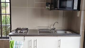 Microwave, stovetop, toaster, cookware/dishes/utensils