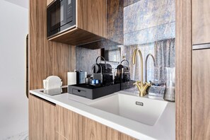Fridge, microwave, stovetop, coffee/tea maker