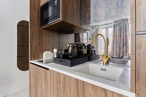 Fridge, microwave, stovetop, coffee/tea maker