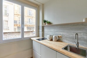 Fridge, microwave, stovetop, coffee/tea maker