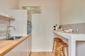 Fridge, microwave, stovetop, coffee/tea maker