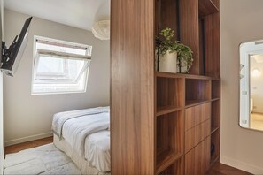 1 bedroom, desk, iron/ironing board, travel crib