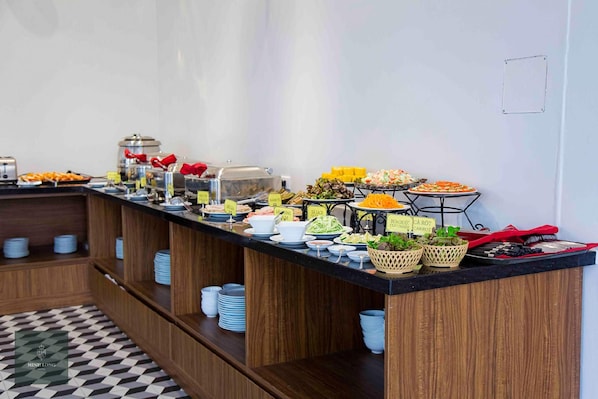 A buffet setup with various food items and labeled containers. - Minh Long Hotel (Hanoi)