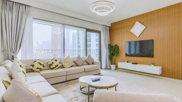 Luxury Apartment, Balcony, City View | Living area | 55-inch Smart TV with digital channels