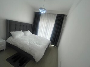 1 chambre, coffre-fort, fer et planche Ă repasser