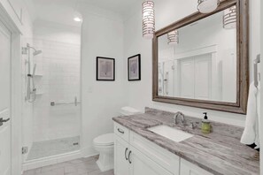 Shower, hair dryer, towels, shampoo