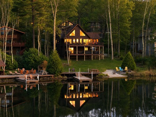 Family-friendly lakefront cabin/chalet with incredible views, private beach, lakeside firepit, boats, hot tub, multiple game rooms, and more