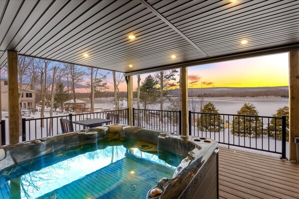 Hot tub and view from the lower level of our brand new, huge 2-story deck overlooking the lake