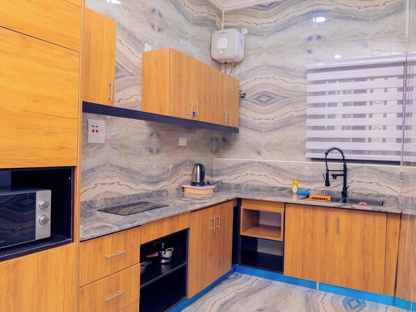 Presidential Penthouse, 1 Bedroom | Private kitchen | Fridge, microwave, dining tables