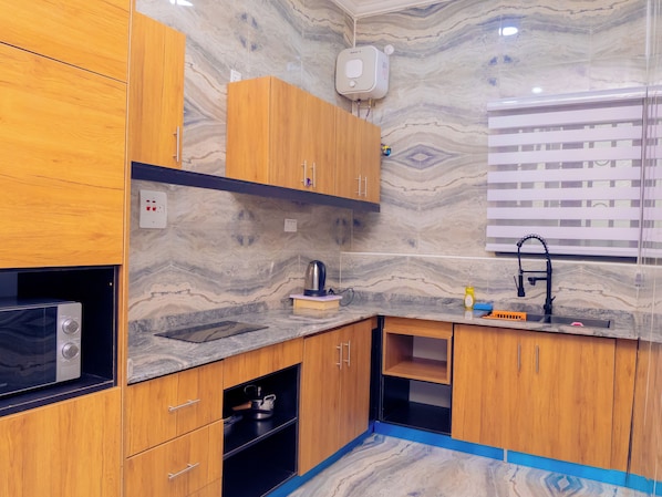 Presidential Penthouse, 1 Bedroom | Private kitchen | Fridge, microwave, dining tables