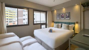 Premium bedding, memory foam beds, desk, laptop workspace