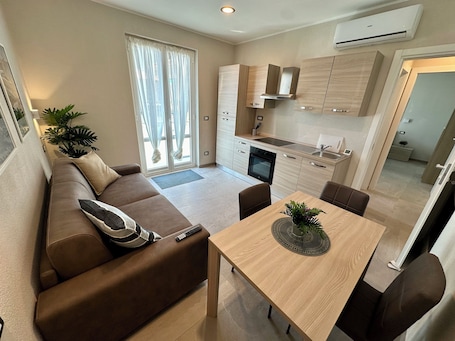 Comfort Apartment, Balcony | Living area | 35-inch Smart TV with digital channels, TV, computer monitors