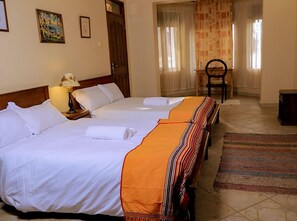 Twin Room, Garden View | Desk, laptop workspace, iron/ironing board, free WiFi