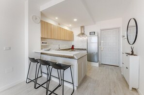 Fridge, microwave, stovetop, coffee/tea maker