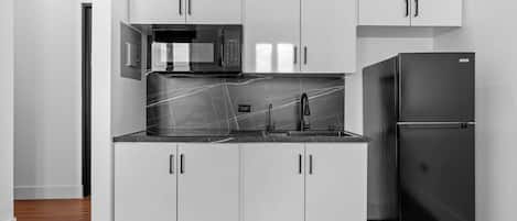 Fridge, microwave, stovetop, coffee/tea maker