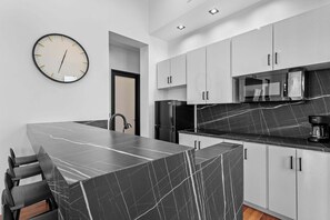 Fridge, microwave, stovetop, coffee/tea maker