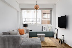 Apartment, 1 Queen Bed with Sofa bed | Living area | 40-inch Smart TV with digital channels