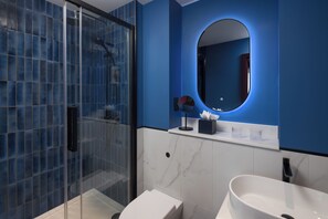 Shower, hair dryer, slippers, towels