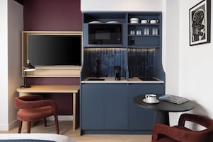 Fridge, microwave, espresso maker, cookware/dishes/utensils