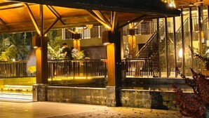 A well-lit entrance to DuSai Resort & Spa with a covered waiting area and a visible do not enter sign. - DuSai Resort & Spa (Moulvibazar Sadar)