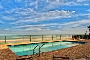 A swimming pool with a view of the beach and ocean. - Oceanfront Escape -  1007 Towers Grande (Daytona Beach Shores)