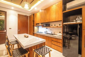 Fridge, microwave, stovetop, coffee/tea maker