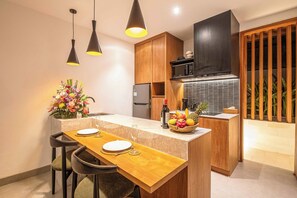 Fridge, microwave, stovetop, coffee/tea maker