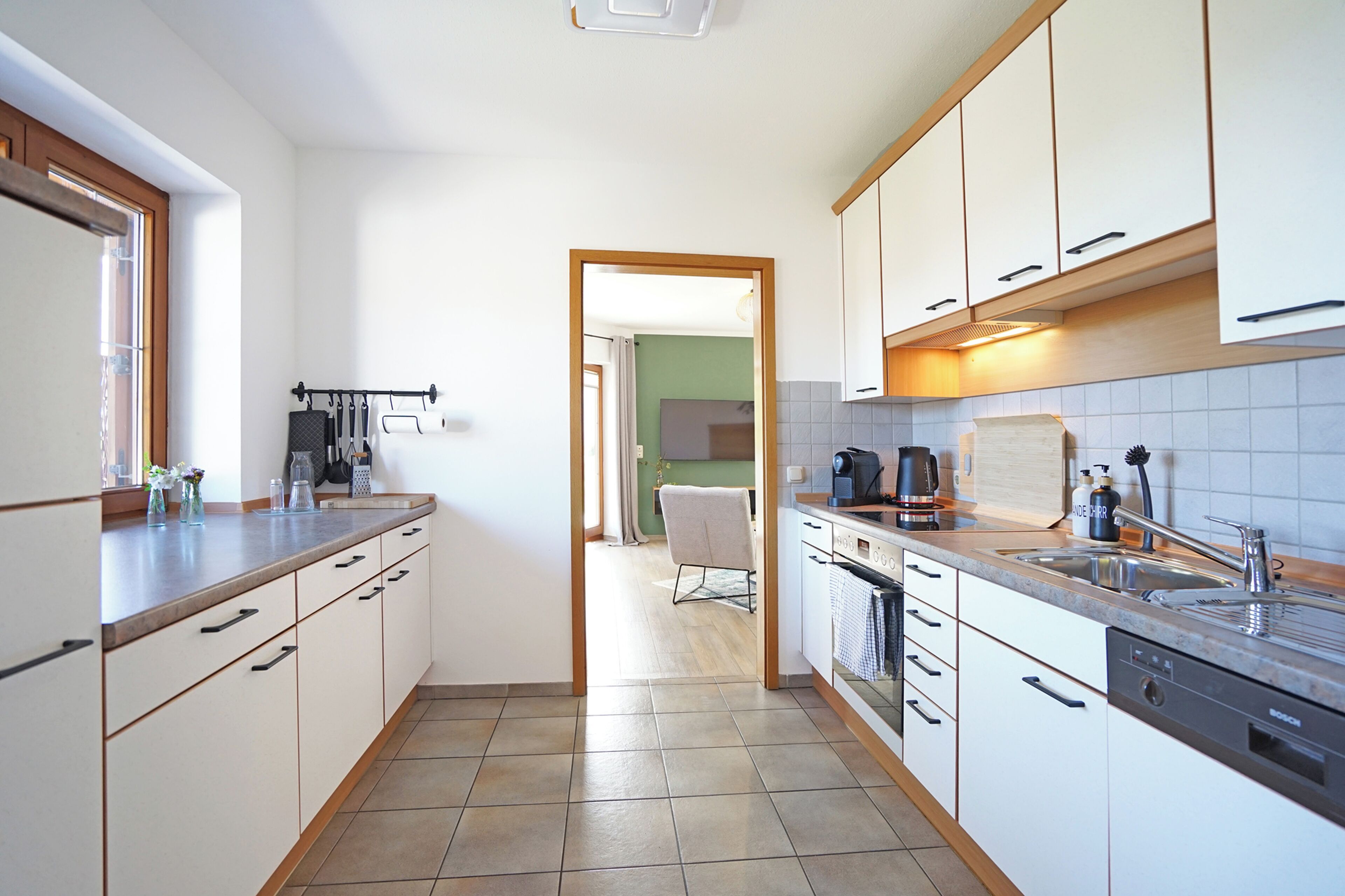 Fridge, stovetop, dishwasher, coffee/tea maker