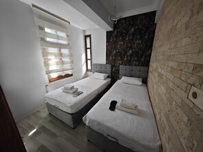 Family Suite, City View | Desk, laptop workspace, free WiFi