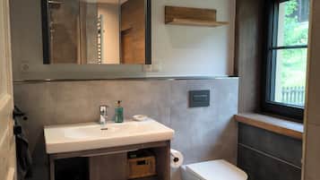 Shower, hair dryer, towels, toilet paper