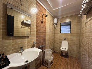 Deluxe Triple Room | Bathroom - Lumora Shanti Kamal (Shirdi)