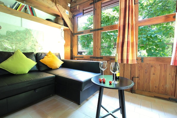 Chalet, Patio, Garden View | Living area | 32-inch flat-screen TV with digital channels