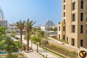 Apartment, Balcony, Pool View | Iron/ironing board, free WiFi