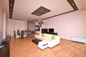 Apartment, 4 Bedrooms, Balcony, City View | Living area | 50-inch flat-screen TV with cable channels - Spacious Apartment by Luxe Group TT606 (Yerevan)