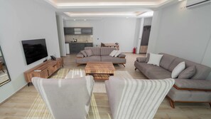 Chambre Deluxe, vue montagne | Coin séjour