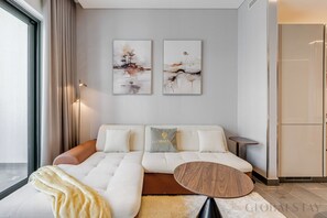 Deluxe Apartment, 1 Bedroom, Kitchen, Desert View | Living area | 43-inch flat-screen TV with satellite channels, Netflix - GLOBALSTAY. The Crest Tower C Apartments (Dubai)